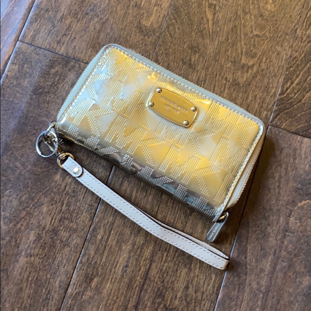 Gold Michael Kors wallet that has been used